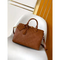 Heritage Embossed Duffle — Tan